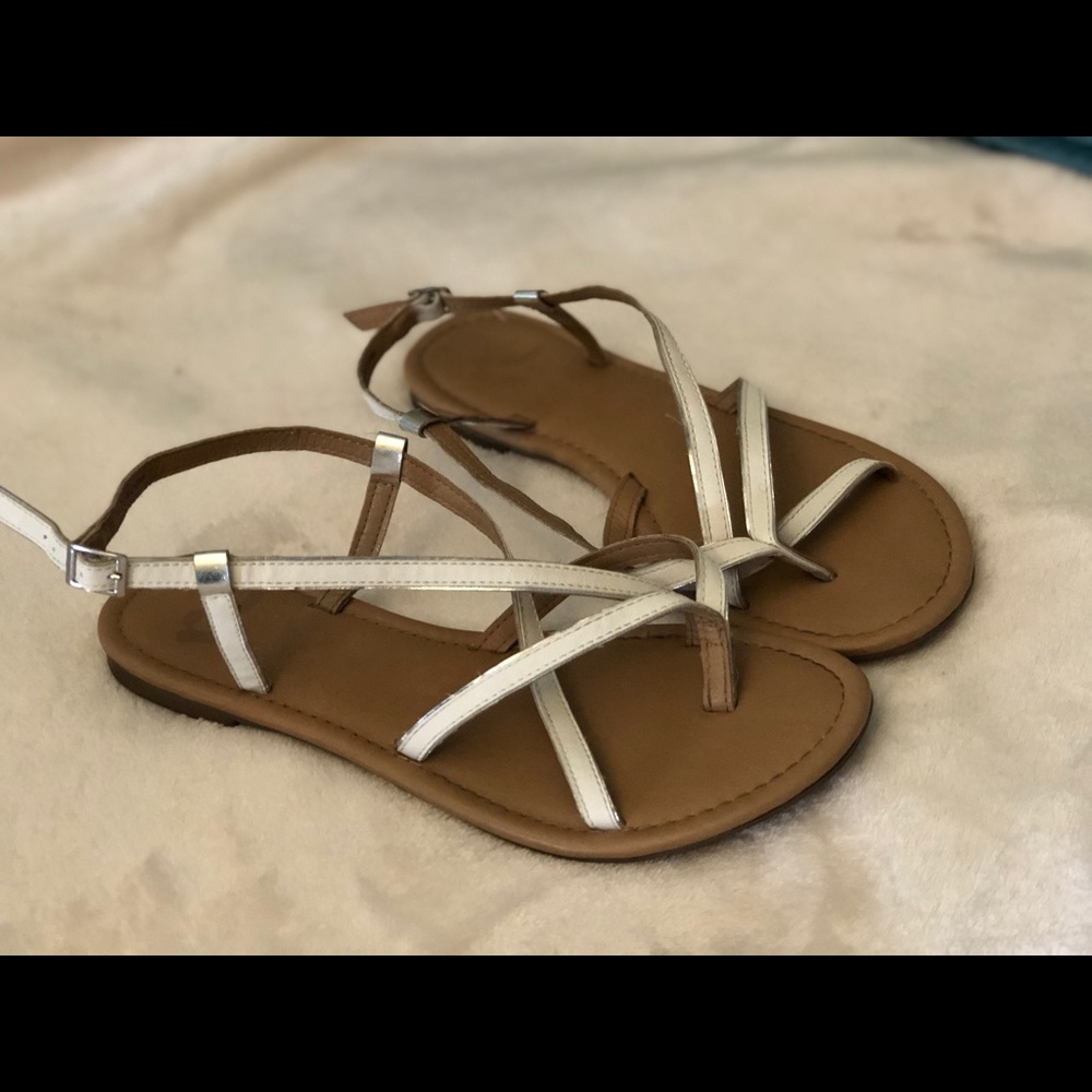 Gently worn white gladiator sandals